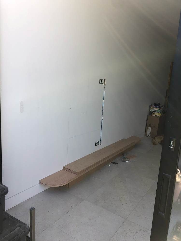 Custom fit-outs and outdoor living: Build: seat framing over services