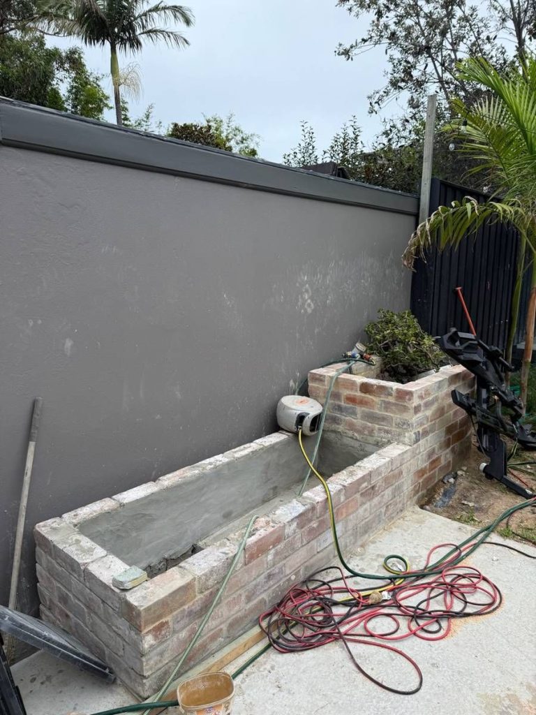 Custom fit-outs and outdoor living: Build: planter walls laid up