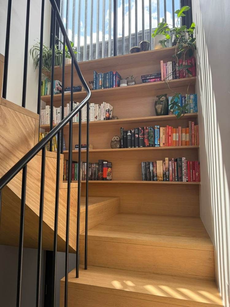 Custom fit-outs and outdoor living: Complete: stair bookshelf