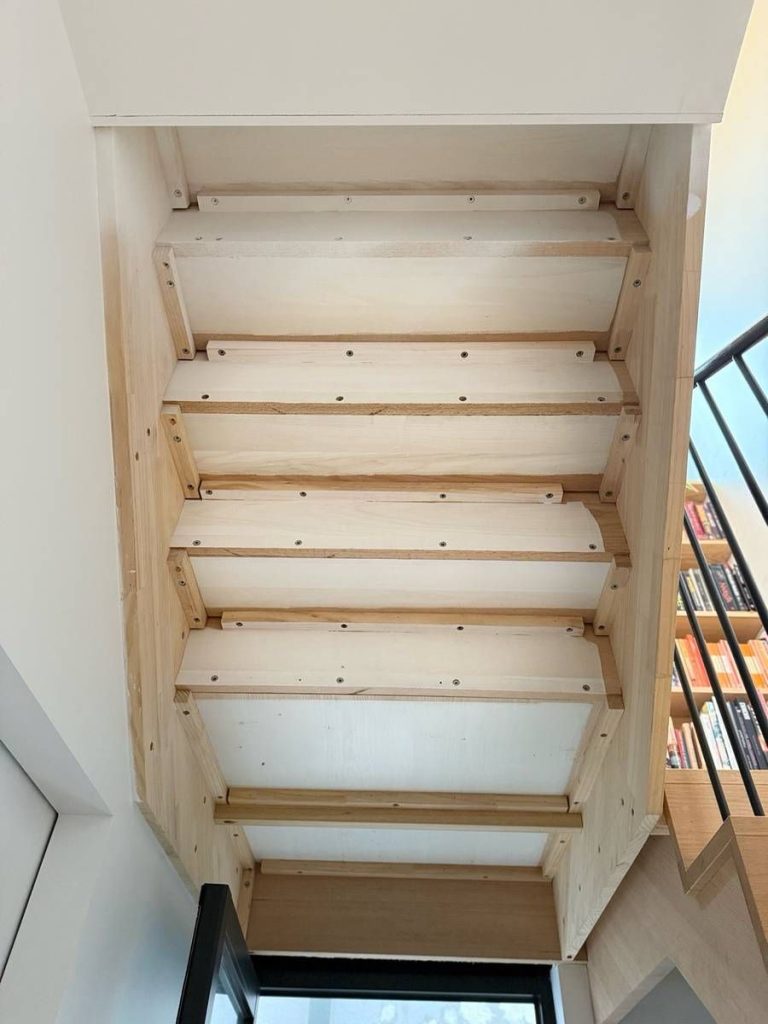 Custom fit-outs and outdoor living: Detail: understairs oak lining