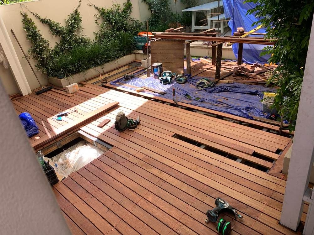 Hardwood deck and courtyard: Build: boards going down
