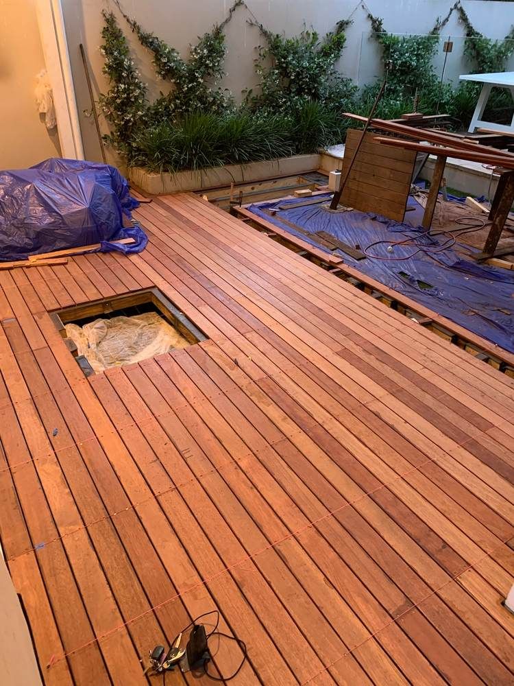 Hardwood deck and courtyard: Build: access hatch framed in